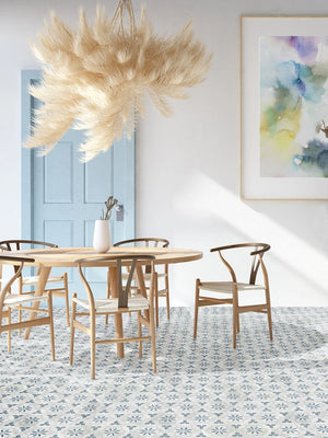 Fez Azure Drift Deco porcelain hexagon tile installed on a café floor.