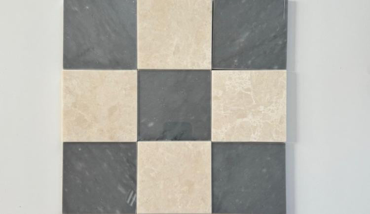 Bardiglio Imperial blue marble and creamy beige marble tiles in a checkerboard pattern, accented by deep red marble and white marble pieces. The rich color palette adds contrast and luxury to any space.