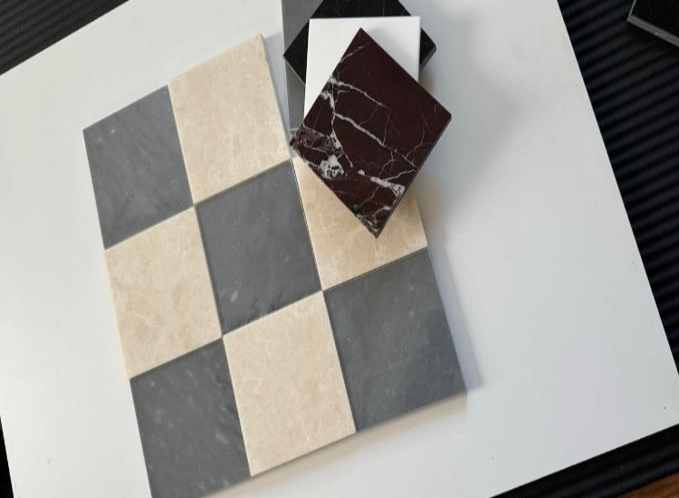 Checkerboard pattern with Bardiglio Imperial blue marble and creamy beige marble tiles, accented by green marble. The combination of deep and light hues creates a color pop that elevates modern tile design.
