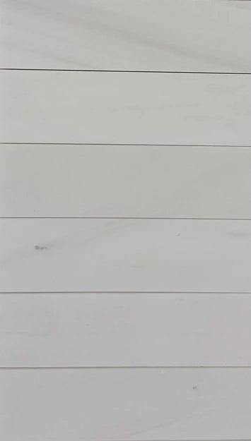 4x12 Bianco Dolomite tiles showcasing a luxurious white surface with soft veining, perfect for walls, backsplashes, and flooring.