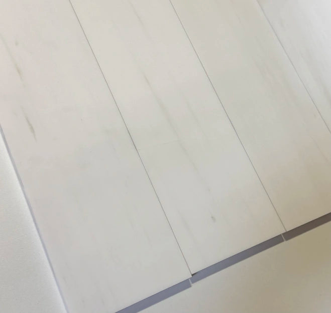 Elegant 4x12 Bianco Dolomite marble tiles with a polished surface, designed for refined residential and commercial spaces.