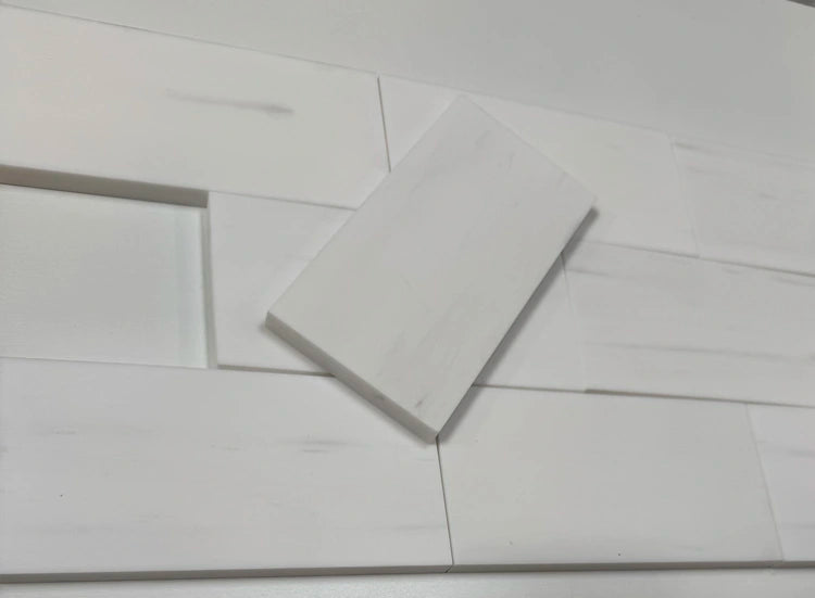 Bianco Dolomite 6x12 subway tiles with a polished finish, arranged in a classic layout, perfect for modern and elegant interiors.