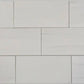 Close-up of Bianco Dolomite subway tiles in 6x12 format, highlighting their smooth white tones and versatile design applications.