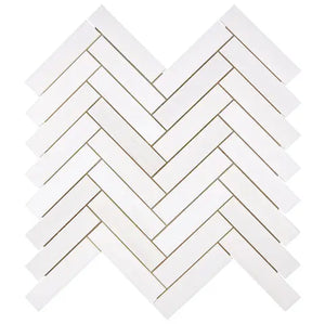 Bianco Dolomite polished 1×4 herringbone marble mosaic.