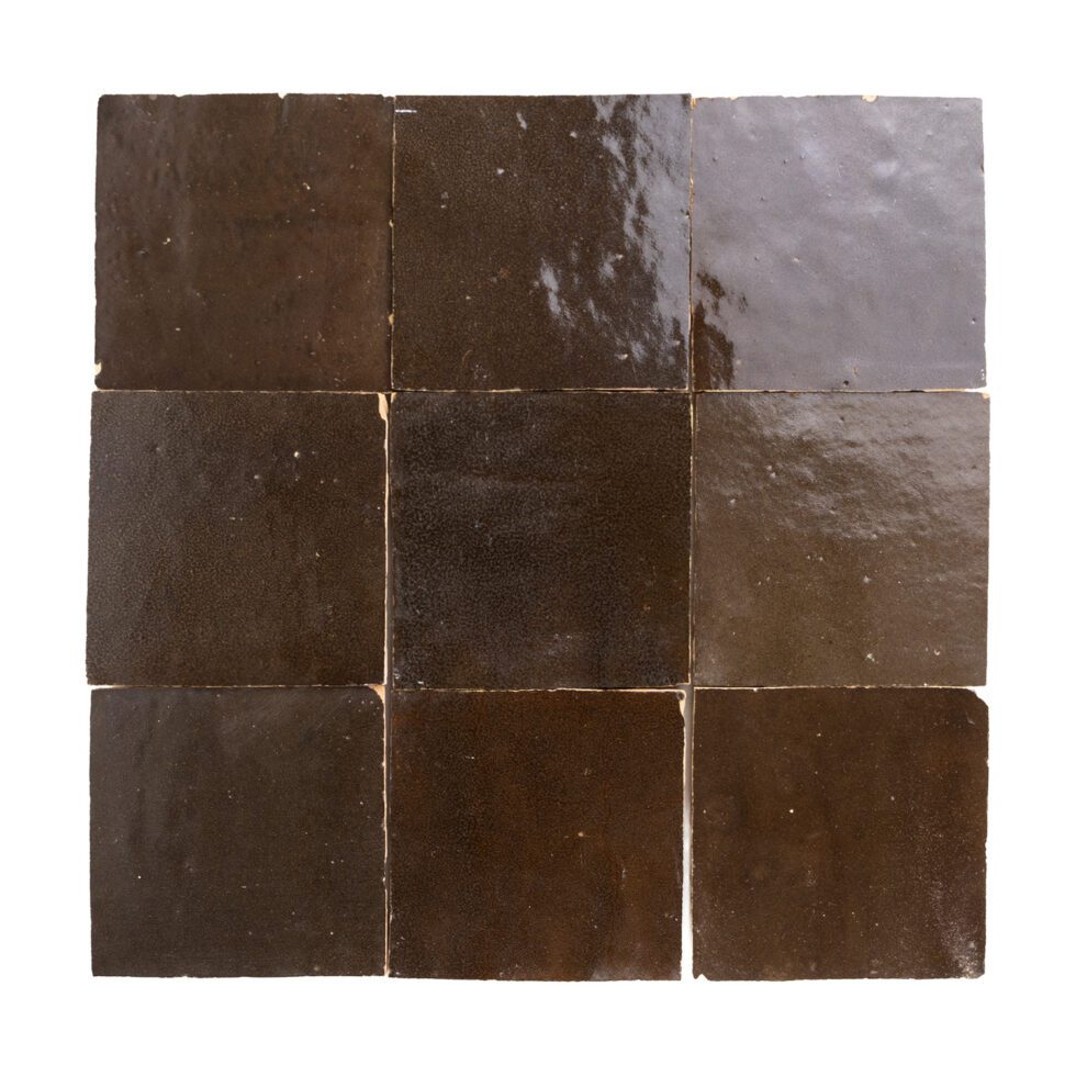 Square zellige tiles with a brown and gray pattern on a white background