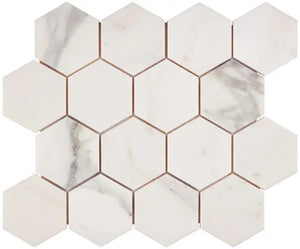 Calacatta Gold marble 3-inch hexagon mosaic with a honed finish.