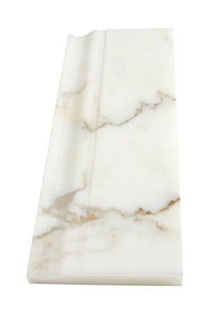 Calacatta Gold marble honed 4¾×12 baseboard close-up.