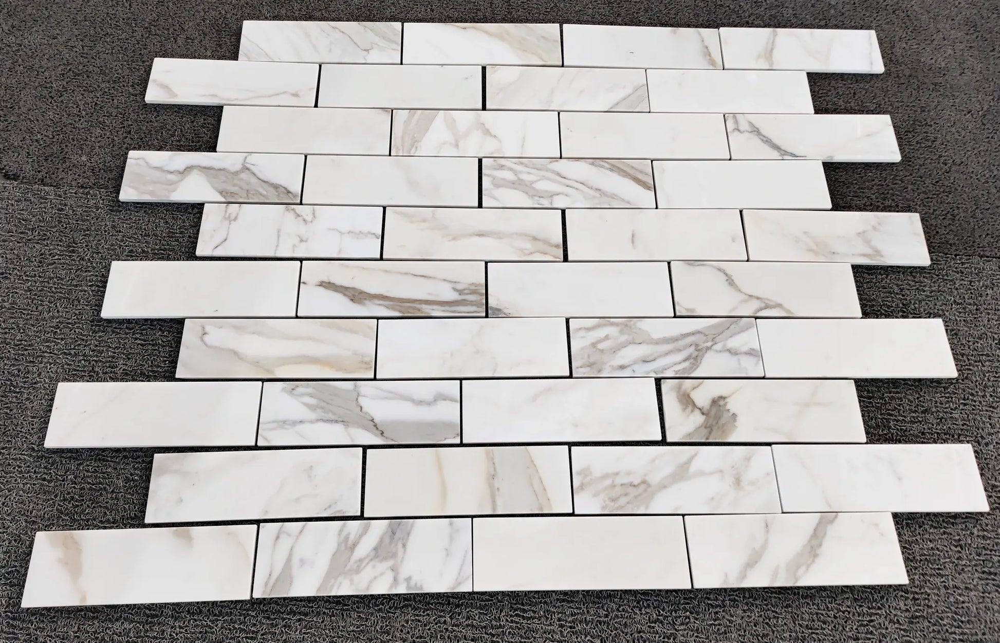 2×8 Calacatta Gold Brick pattern