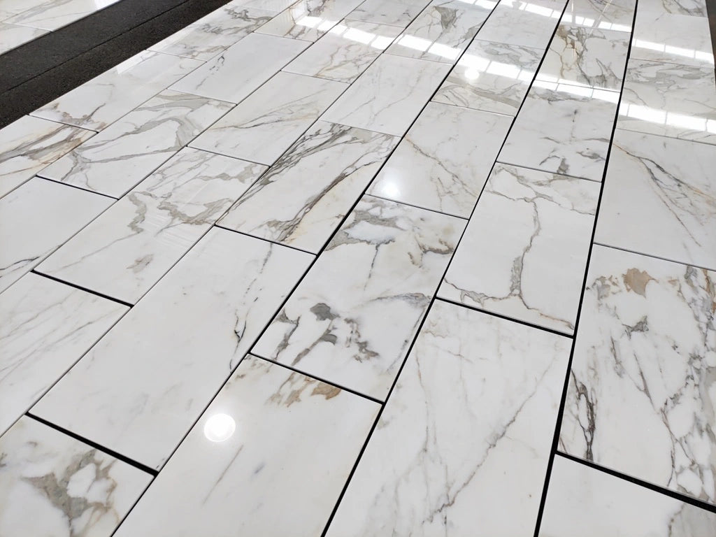 Calacatta Gold honed 18×36 inches marble tile.