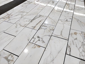 Calacatta Gold honed 18×36 inches marble tile.