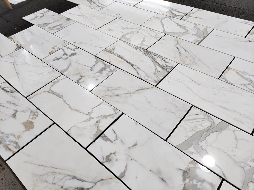 Calacatta Gold polished 18×36 inches marble tile.