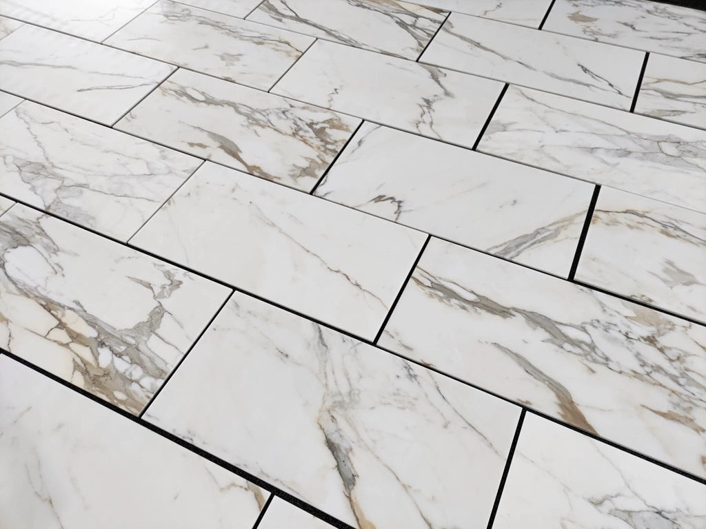 Calacatta Gold 18×36 inches marble tile finish comparison or secondary view.