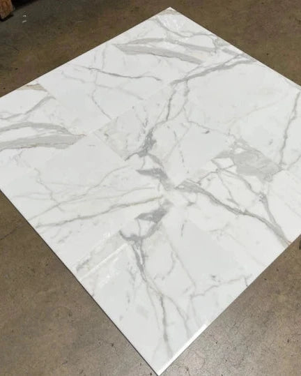 Calacatta Gold Marble Tile dry-lay showcasing luxury main floor selection from in-stock inventory