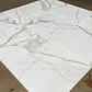 a close up image - Calacatta Gold Marble 24x24 Tile dry-lay showcasing luxury main floor selection from in-stock inventory