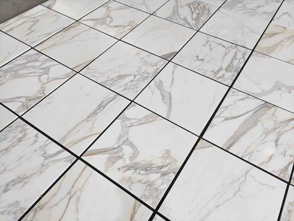 Calacatta Gold polished 24×24 inches marble tile.