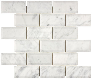 Carrara White Gioia marble 2×4 deep-beveled mosaic close-up.