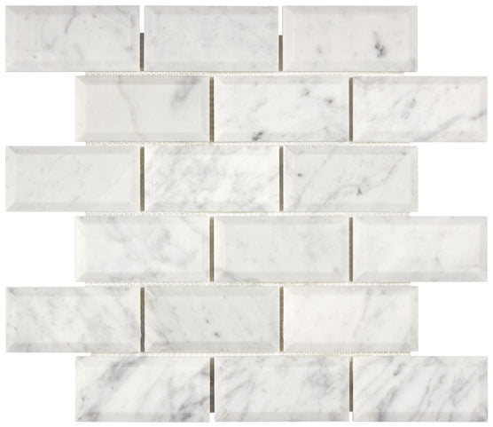 Carrara White Gioia marble 2×4 deep-beveled mosaic close-up.