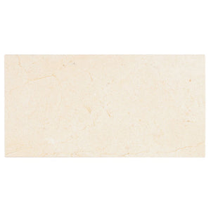 Crema Marfil polished 12×24 marble tile.