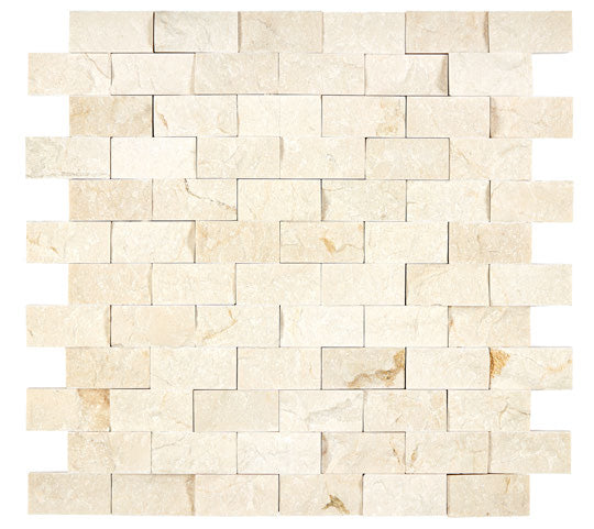 Crema Marfil 1×2 split-face mosaic installed as a dimensional wall accent.