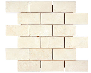 Crema Marfil honed 2×4 brick marble mosaic.