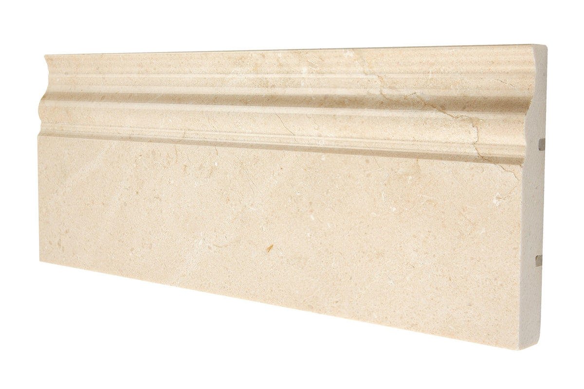 Crema Marfil marble 4¾×12 baseboard trim in polished and honed finishes, warm beige with soft veining.