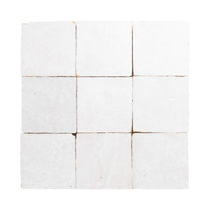White zellige 4x4 tile with brown grout on a white background