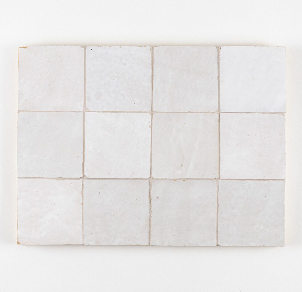 White zellige tiles with subtle variations on a white background