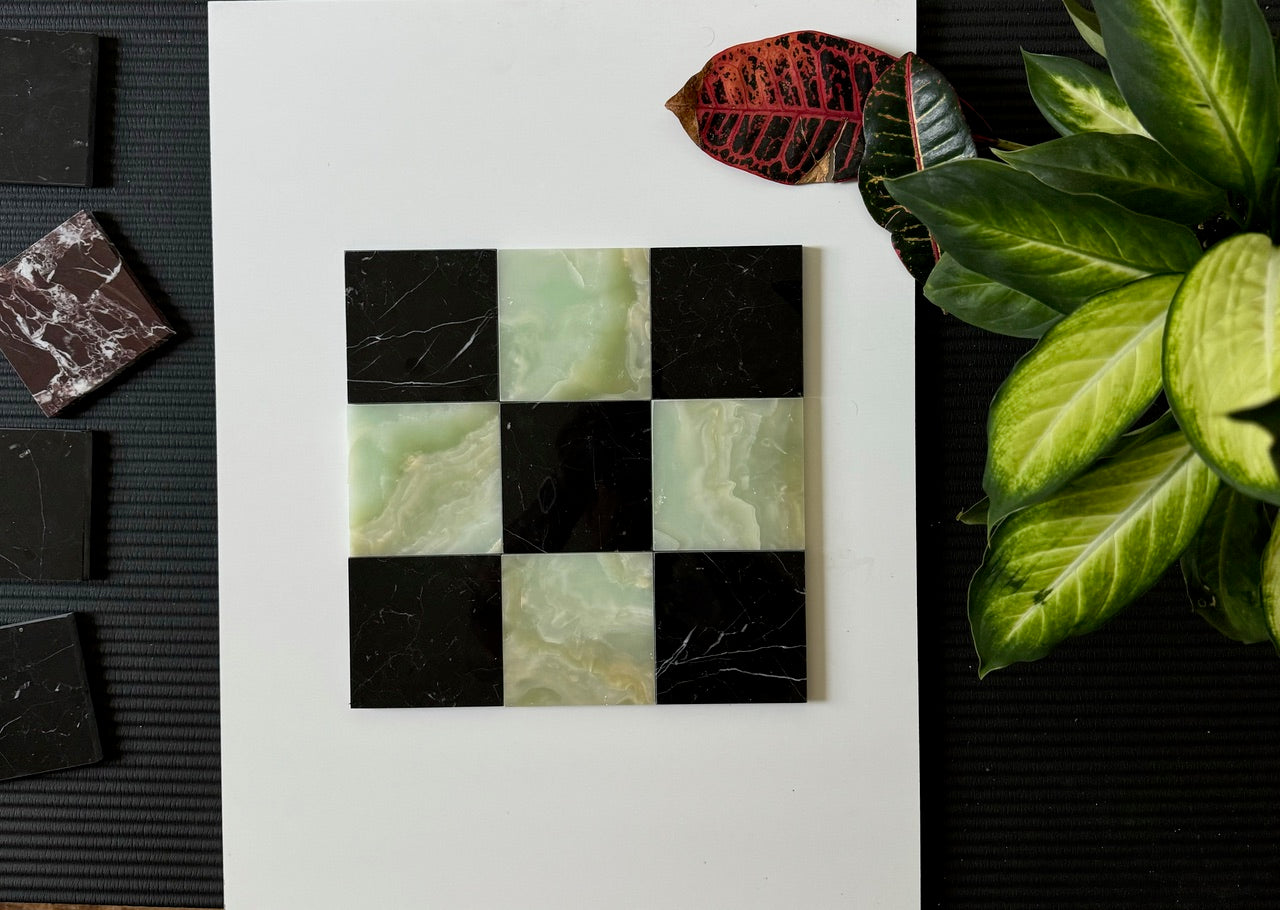 Checkerboard tile layout showcasing the blend of Nero Marquina black marble and translucent Green Onyx stone. This elegant combination of dark and light tones creates a visually striking effect, suitable for both residential and commercial spaces.
