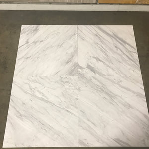 Calacatta Supreme 24×24×¾ polished marble showing a white field and gray mineral movement.