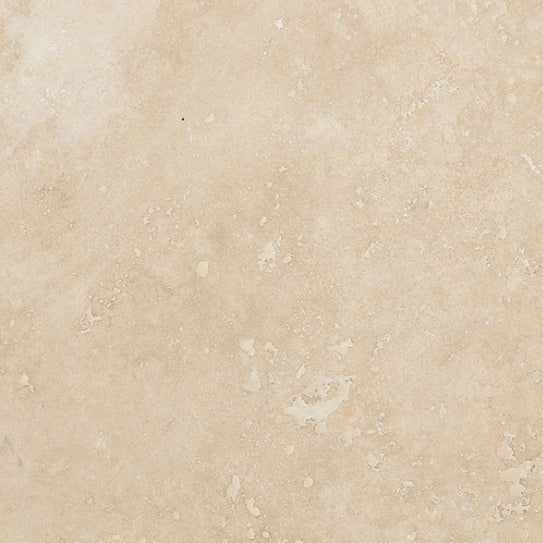Ivory Travertine 4×4 and 6×6 tile close-up in a honed and filled finish, warm ivory-beige natural stone.