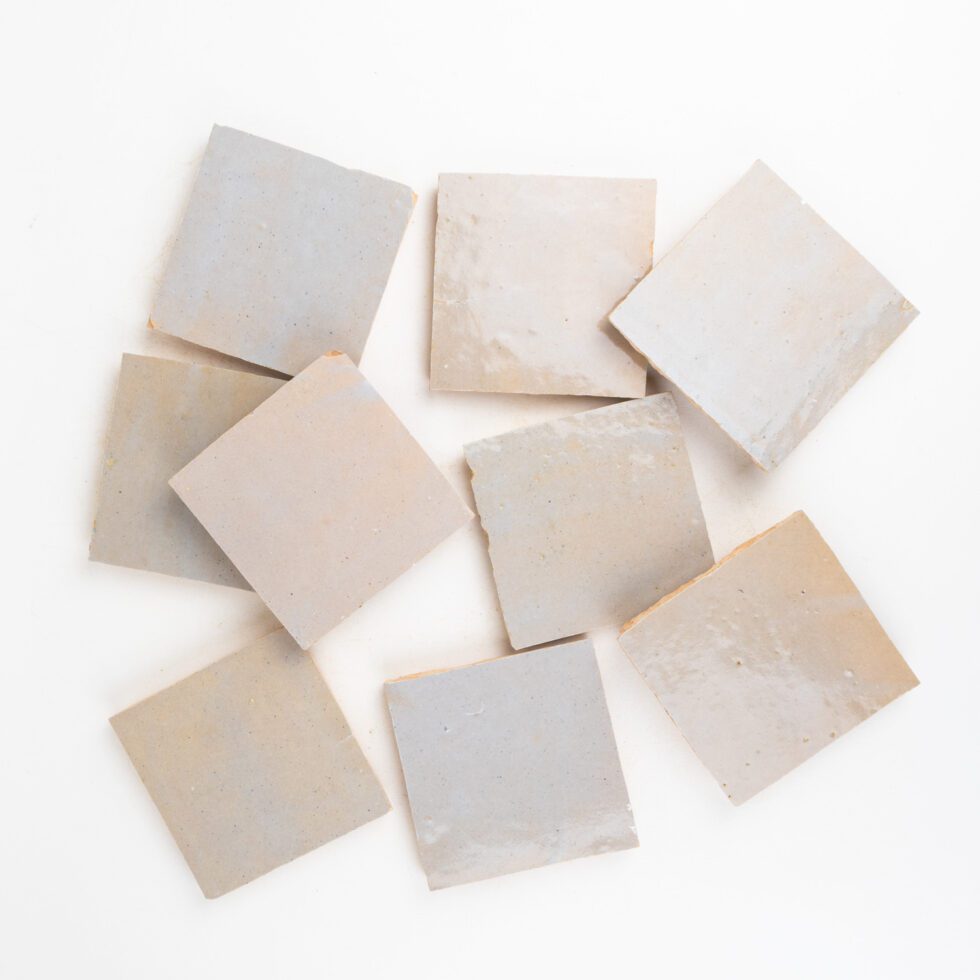 Set of square moroccan zellige tiles on a white background