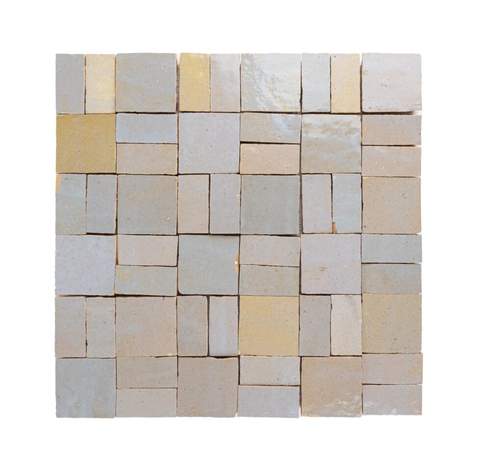 Mosaic zellige tile pattern with various shades of beige and gray on a white background