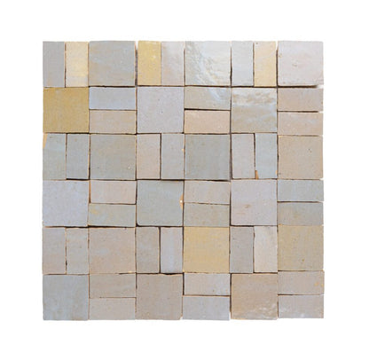 Mosaic zellige tile pattern with various shades of beige and gray on a white background