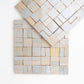 Zellige mosaic pattern of square tiles in neutral colors on a white background