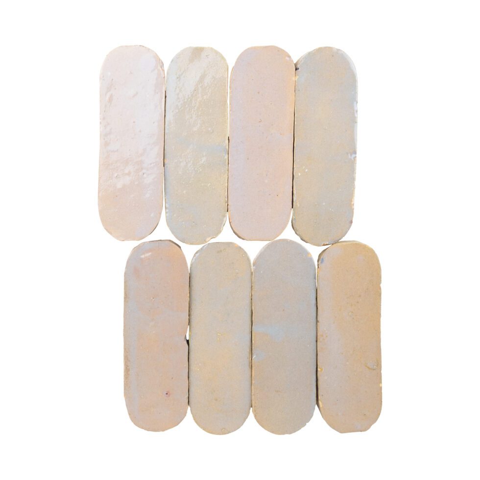 Set of eight beige oval-shaped zellige mosaic tiles on a white background