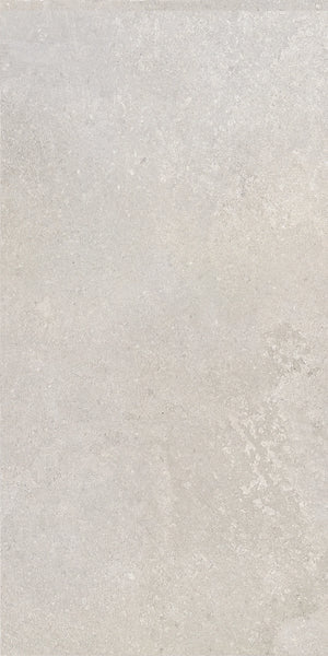 Urban White 12x24 porcelain tile adding a sleek and light finish to a modern bathroom floor