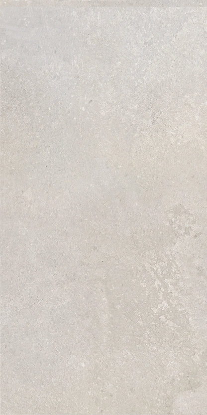 Urban White 12x24 porcelain tile adding a sleek and light finish to a modern bathroom floor