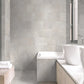 Urban White 12x24 porcelain tile adding a sleek and light finish to a modern bathroom floor and wall.