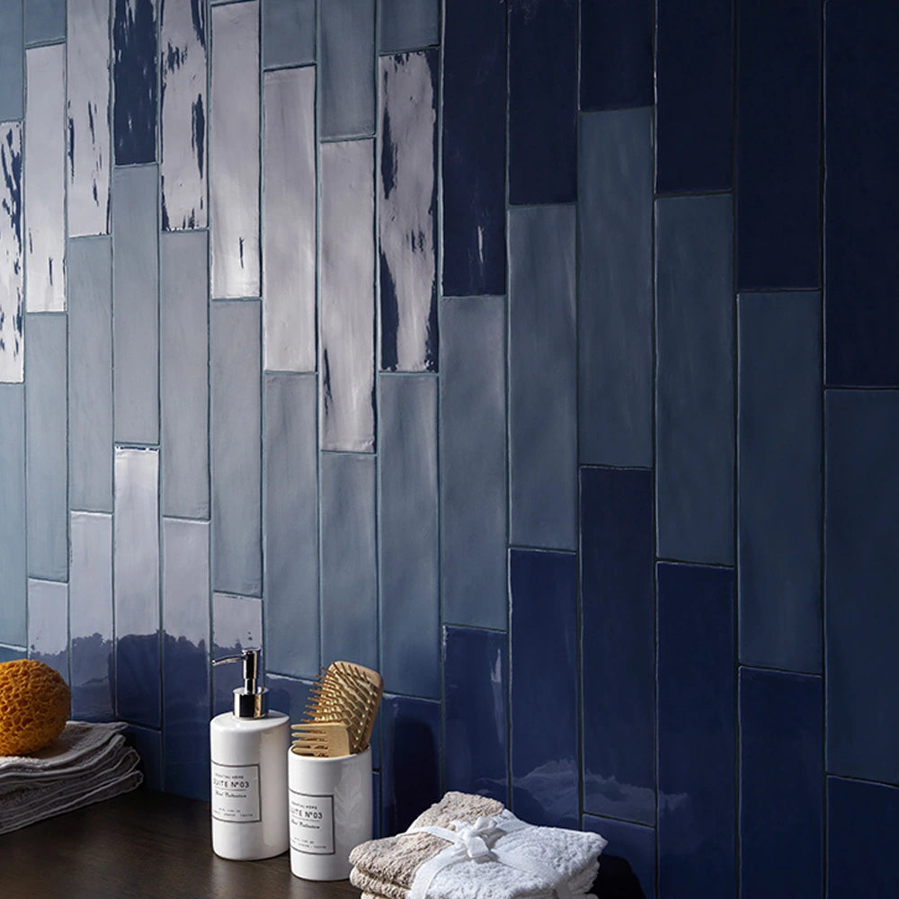 Midnight Blue glossy ceramic tile installed in a bathroom wall.