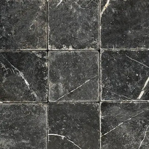 Nero Marquina 6x6 tumbled black marble tile with matte texture for rustic floors and bathrooms.