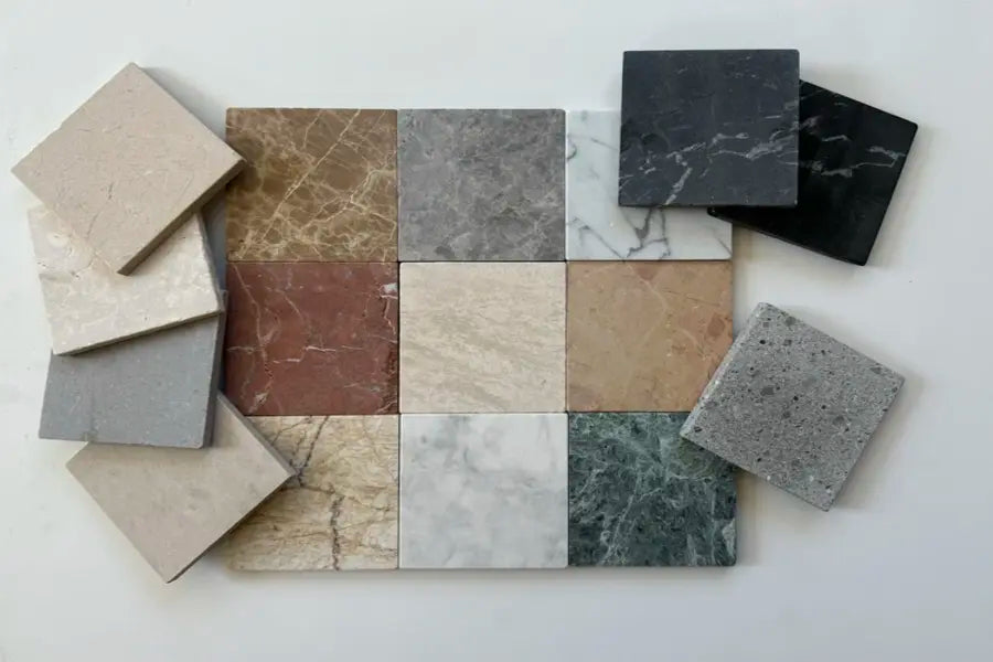 Assortment of 4x4 tumbled natural stone tiles in a variety of colors and textures, highlighting the natural beauty of stone, ideal for creating rustic or classic interior surfaces in the tile and stone industry.