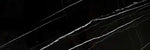 Nero Marquina 4x12 polished black marble subway tile with white veining for backsplashes.