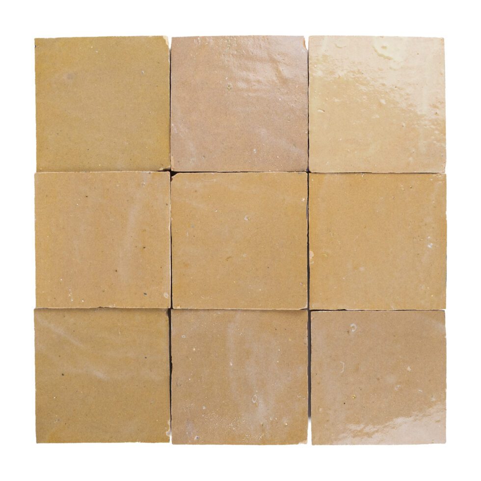 Nine square zellige tiles of beige-amber color arranged in a 3x3 grid on a white background