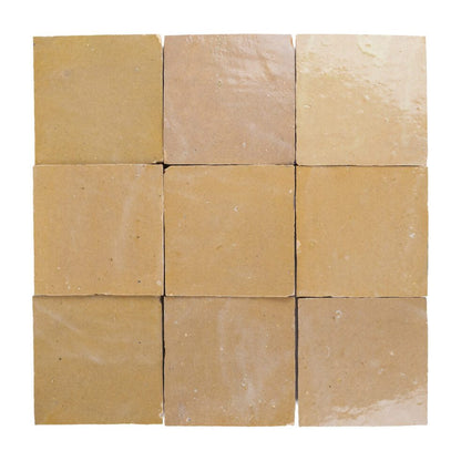 Nine square zellige tiles of beige-amber color arranged in a 3x3 grid on a white background