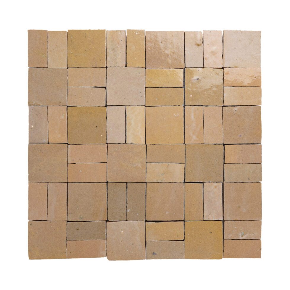 Square arrangement of beige zellige tiles on a white background