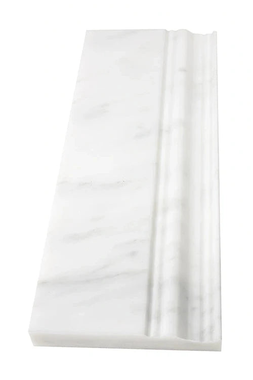 Oriental White Marble Baseboard in 4 ¾ x 12 inches, polished and honed finish with subtle gray veining.