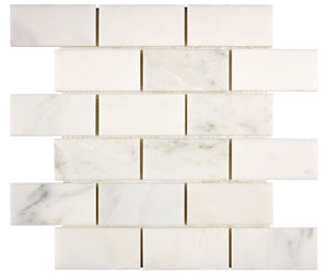 Oriental White marble 2×4 brick mosaic in an interior wall application.