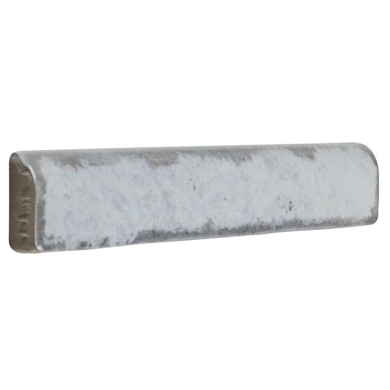 Soft Silver Mist 1x6 ceramic trim piece, providing a polished finish for a bathroom accent wall.