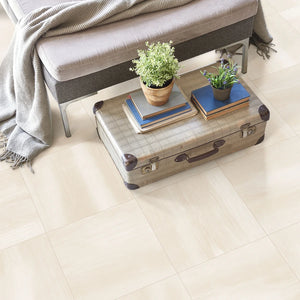 Desert Ivory 24x24 large-format porcelain tile adding warmth and sophistication to a bedroom floor.