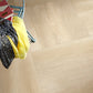 Sandstone Beige 24x24 large-format porcelain tile enhancing a spacious living room floor.